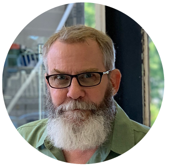 A man with glasses and a beard is in a circle