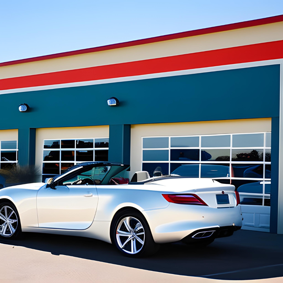 A silver convertible is parked in front of a building