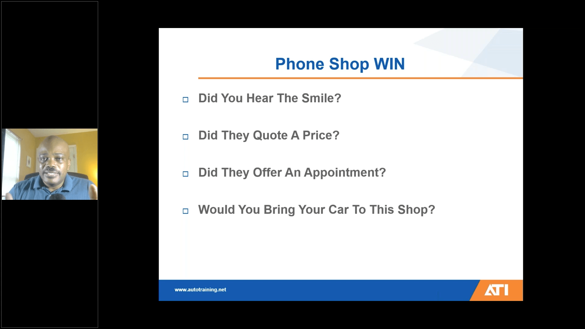 A man is sitting in front of a screen that says phone shop win