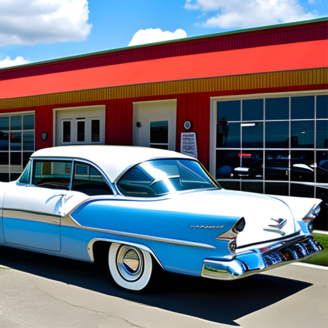 A blue and white car is parked in front of a red building