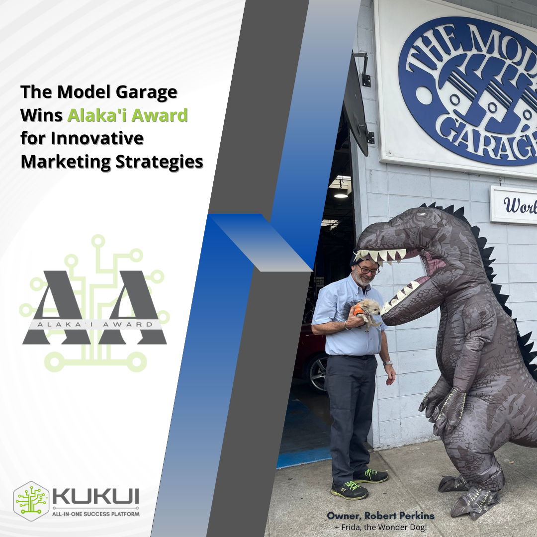 A man in a dinosaur costume stands in front of the model garage