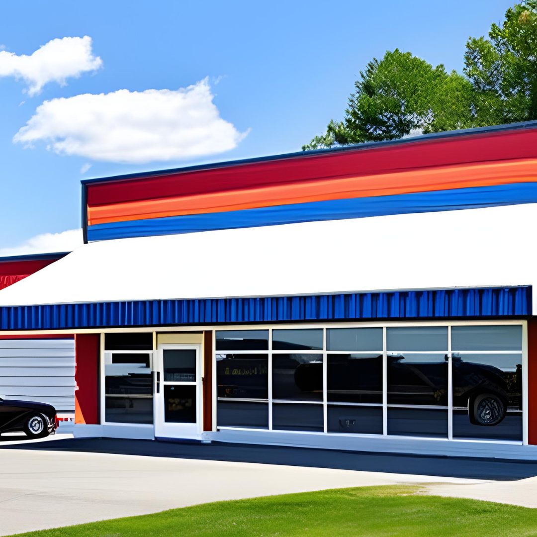 A red white and blue building with a car parked in front of it