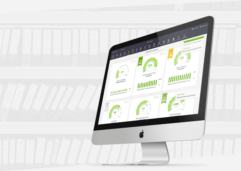 Desktop monitor displaying a green analytics dashboard on a light background