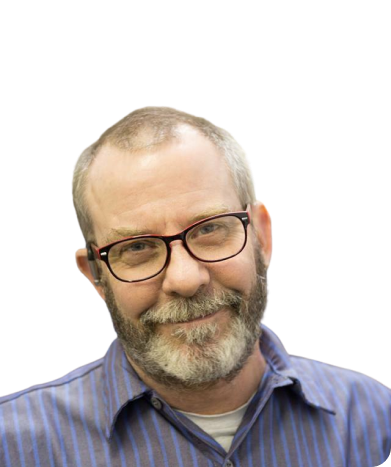 A man with glasses and a beard is smiling for the camera.