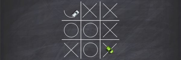 A chalkboard with a tic tac toe game on it