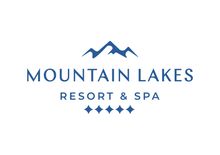 A logo for mountain lakes resort and spa with a mountain in the background.