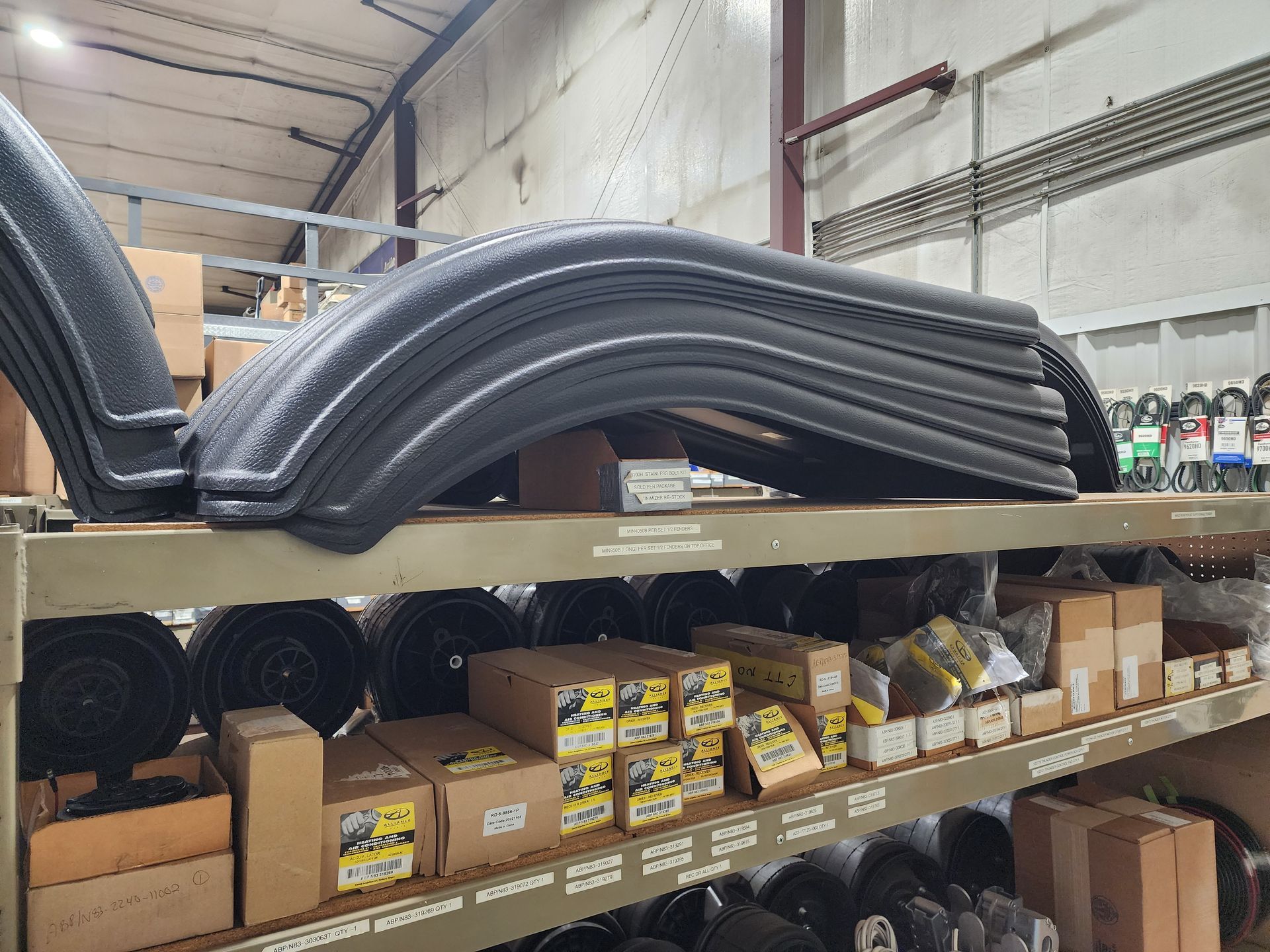 A warehouse filled with lots of boxes and tires.