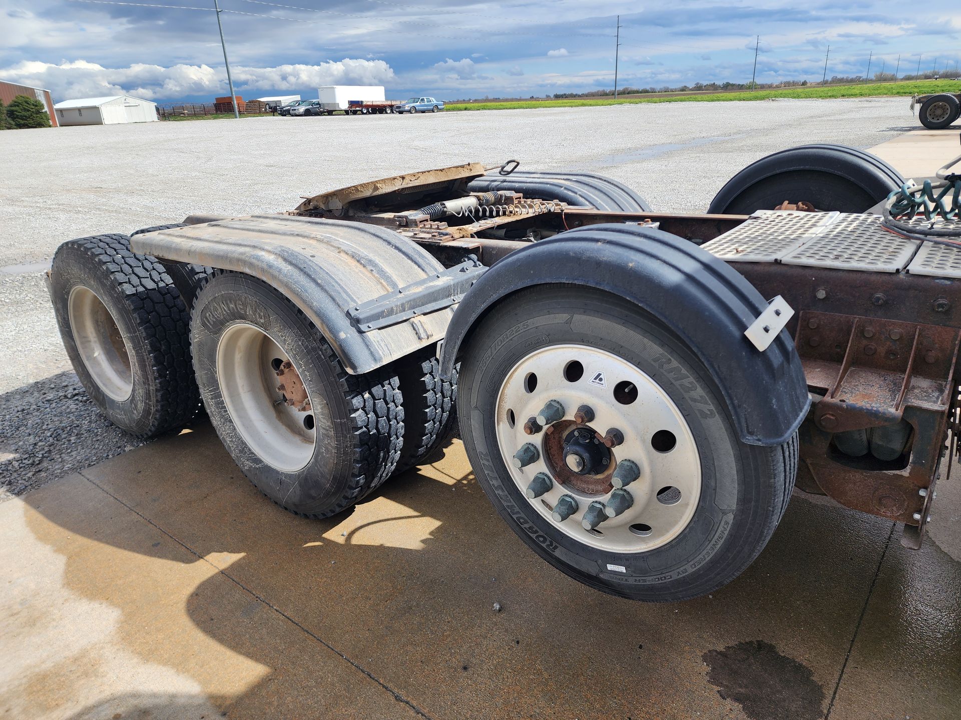 A semi truck is parked on the side of the road