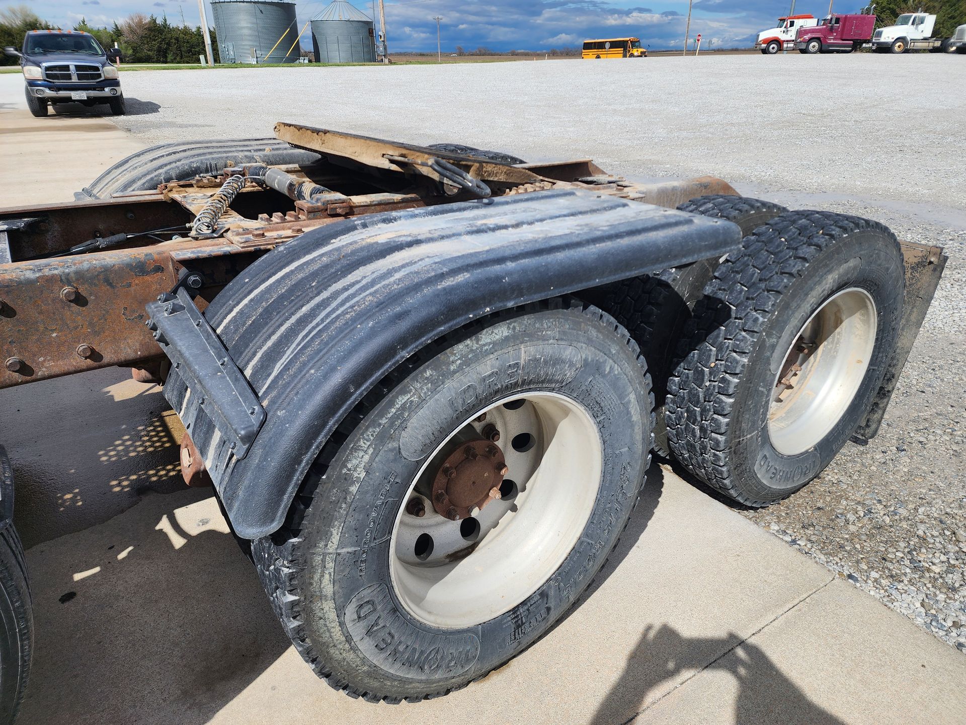 A semi truck is parked on the side of the road