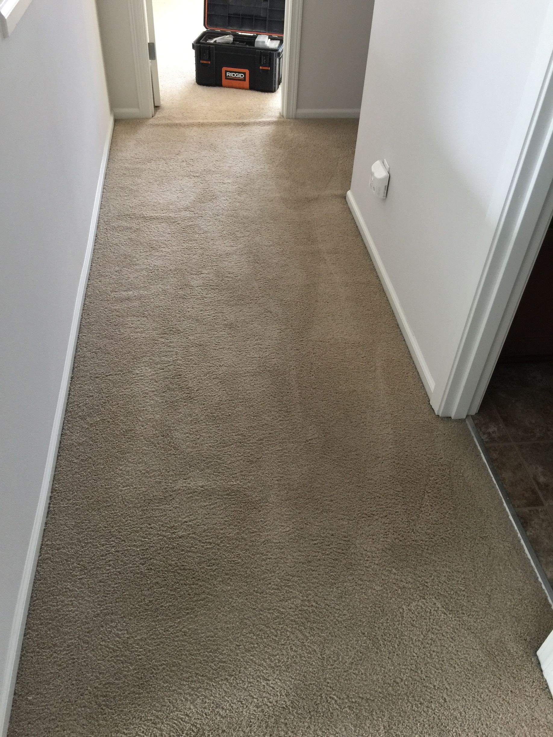 Hallway after carpet seam was repaired by Carpets by Chris Stretching & Repair in Seattle
