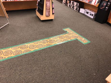 Area of Carpet missing in book store where cabinet had been removed before Carpets by Chris Stretching & Repair patched it perfectly