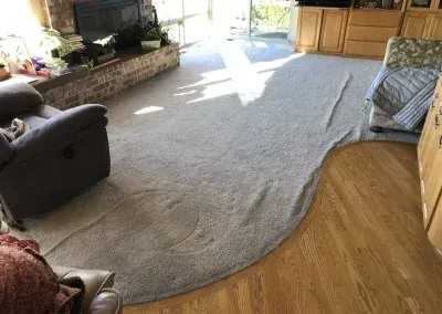 Wrinkled Carpet in a living room before Carpets by Chris Stretching & Repair stretched it perfectly.