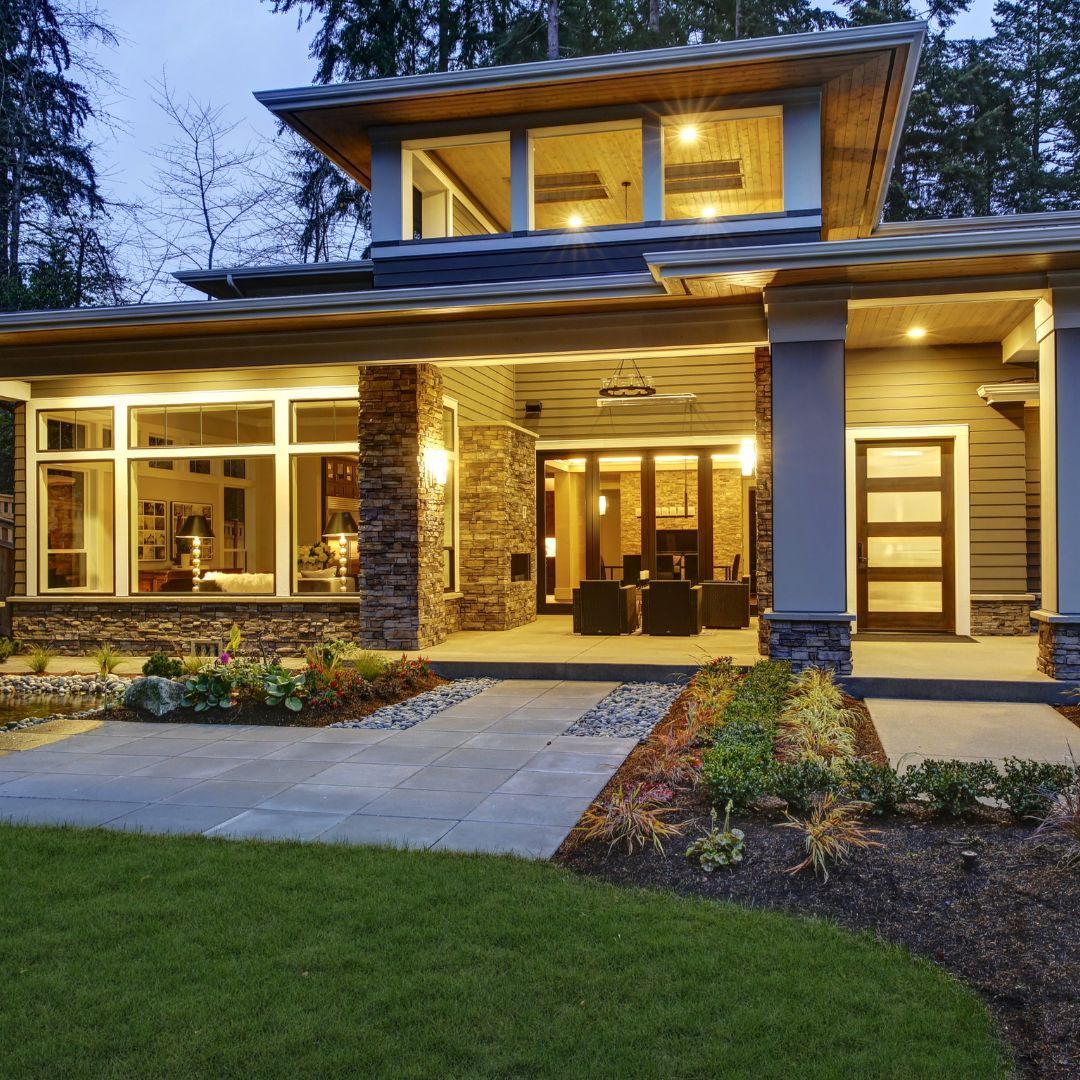 A house with a large porch and lots of windows