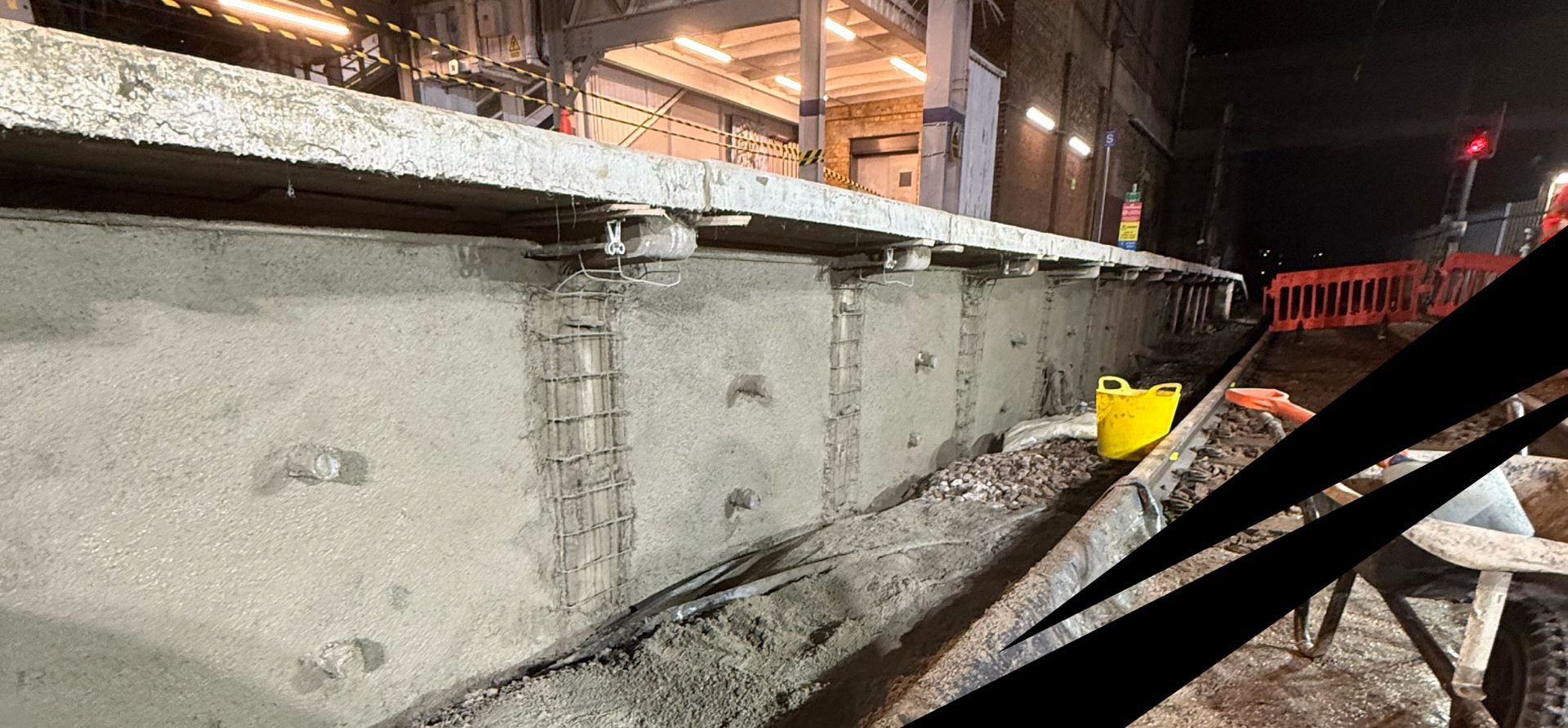 A concrete retaining wall being repaired during overnight works at Leigh-on-Sea Railway station.