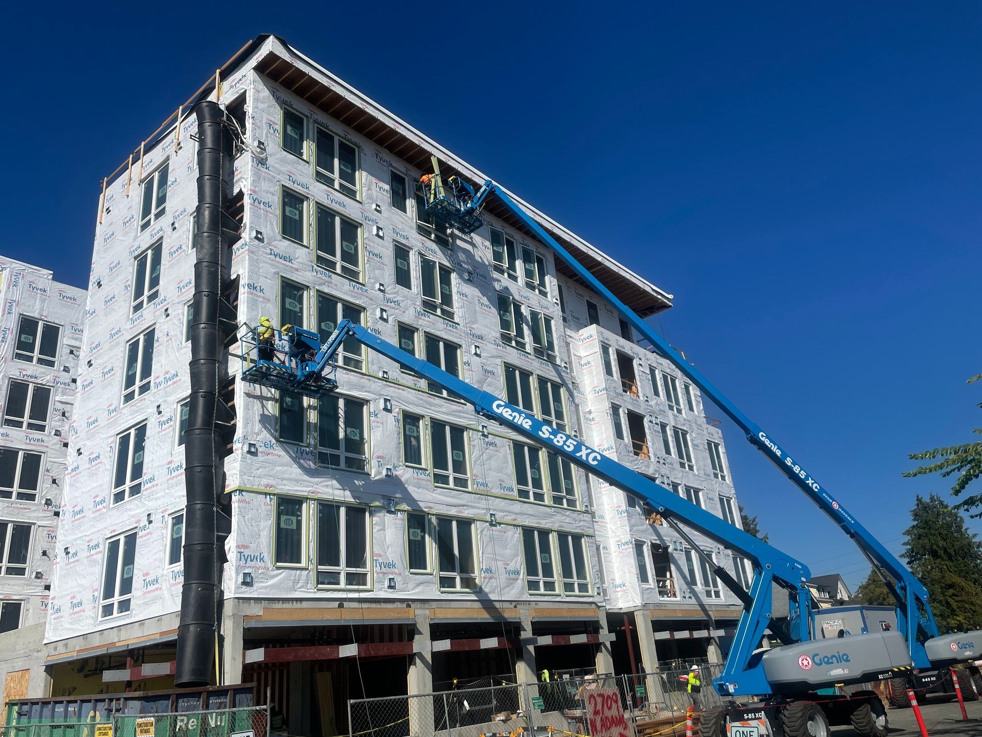 A large building is being built with a crane attached to it.