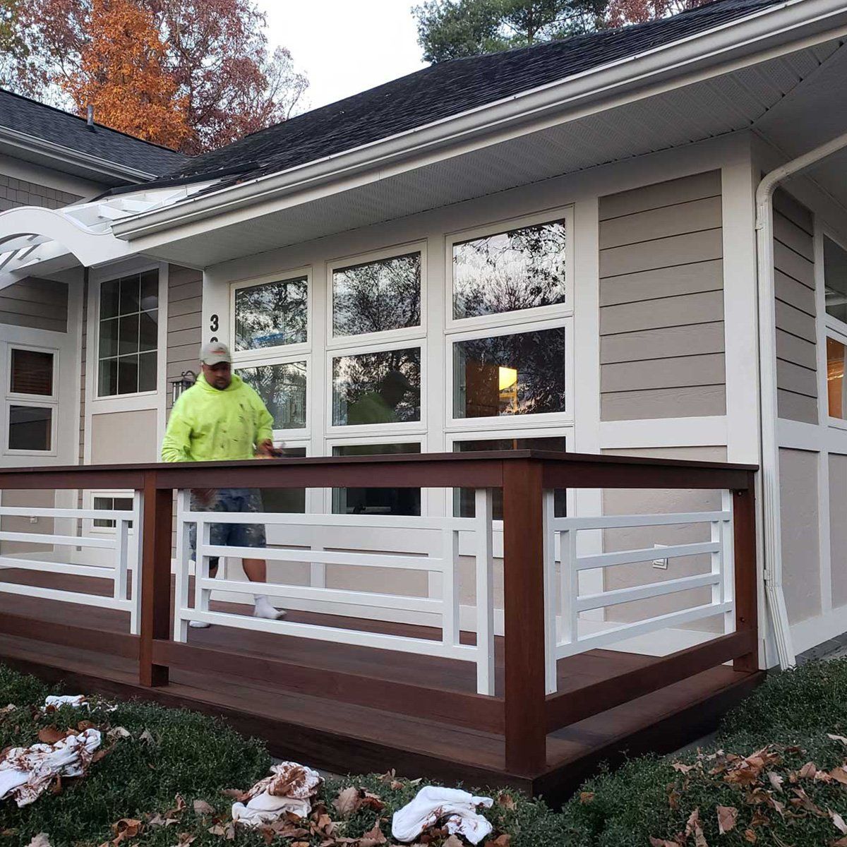 Man Painting the House Deck — Harrisonburg, VA — Xtreme Painting Man Painting the House Deck — Harrisonburg, VA — Xtreme Painting