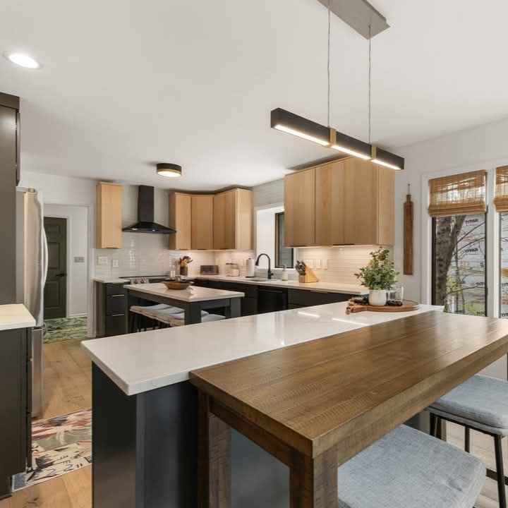 Split view of a kitchen before and after cabinet painting: worn brown wood beside bright blue cabinets