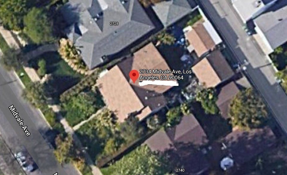 An aerial view of a residential area with lots of houses and trees.