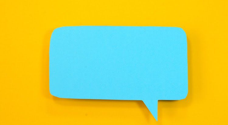 A blue speech bubble on a yellow background.