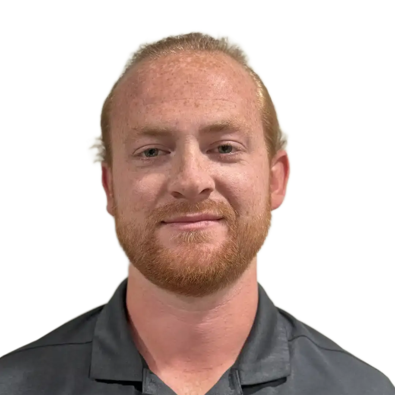 Portrait of a man with red hair and beard wearing a dark gray collared shirt against a white background