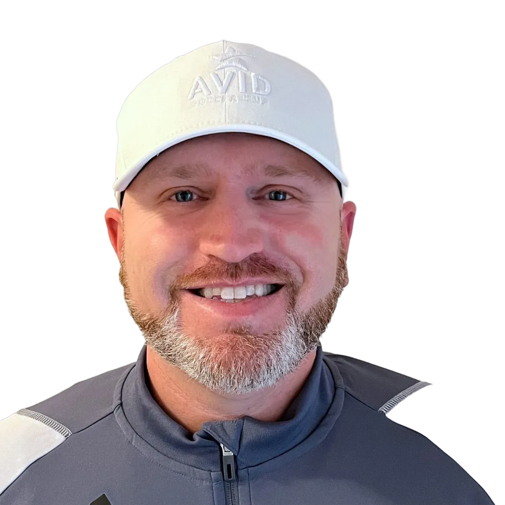 Smiling man in a white cap and gray jacket against a white background