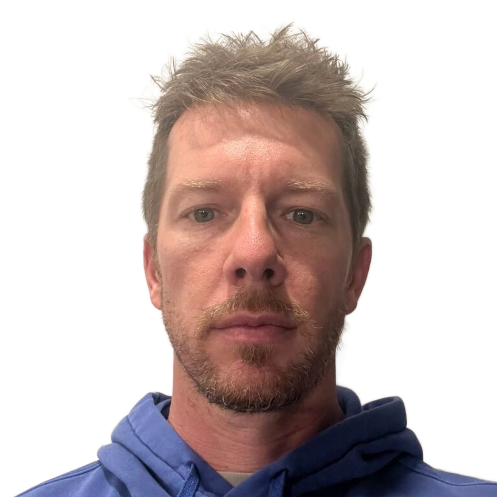 Man in a blue hoodie facing forward against a plain white background