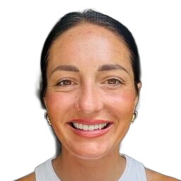 Smiling person with dark hair, wearing a white top against a plain white background