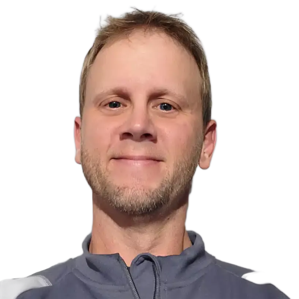 Smiling man in a gray jacket against a white background