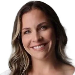 Smiling woman with long dark hair against a white background