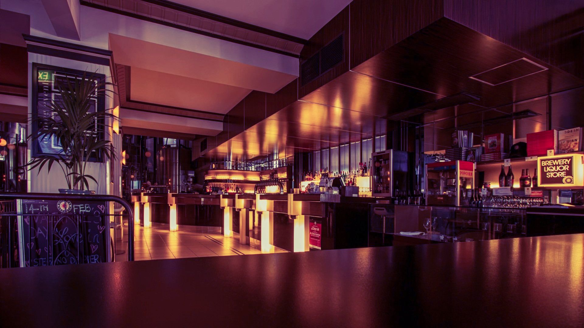 A blurred image of a restaurant with a table in the foreground.