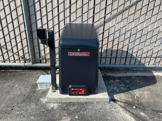 LiftMaster CSL24UL slide gate operator installed on a commercial chain link gate in Bakersfield CA