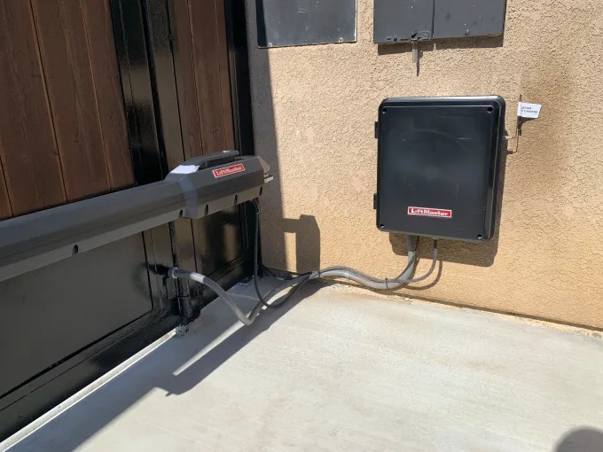 LiftMaster gate operator installed on a completed wood infill slide gate in Bakersfield CA