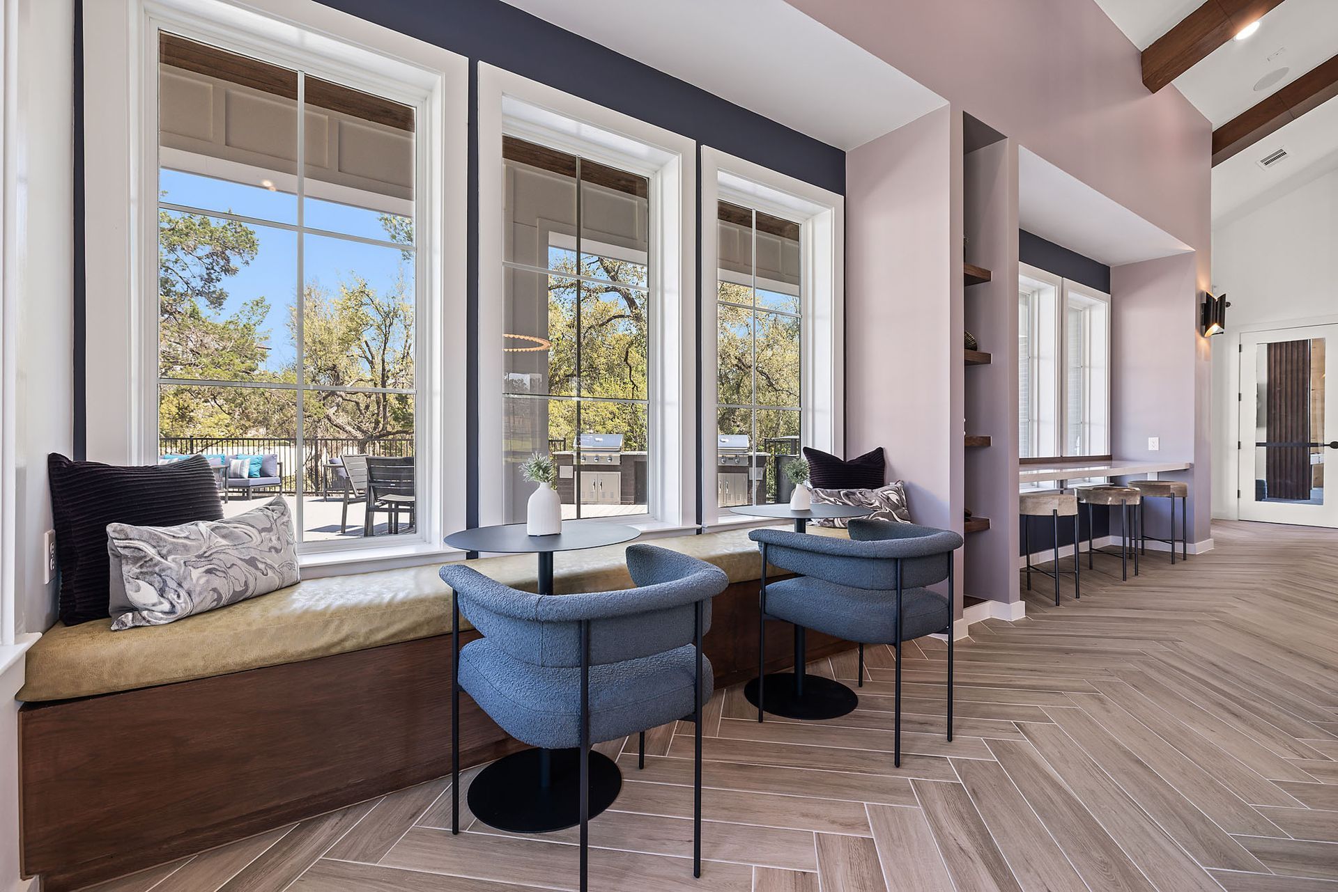 Resident lounge with a lot of windows and chairs at The Everett, offering apartments for rent in Northwest Austin, TX.