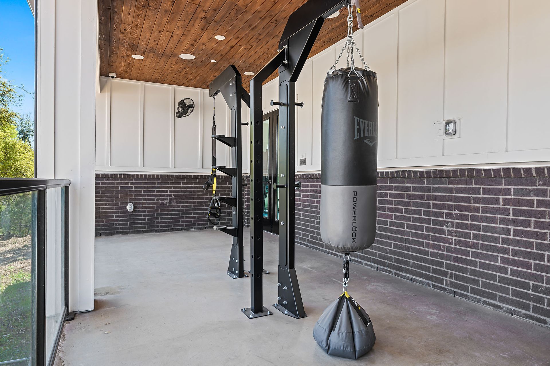 A boxing bag is hanging from the ceiling of a gym at The Everett, offering apartments for rent in Northwest Austin, TX.