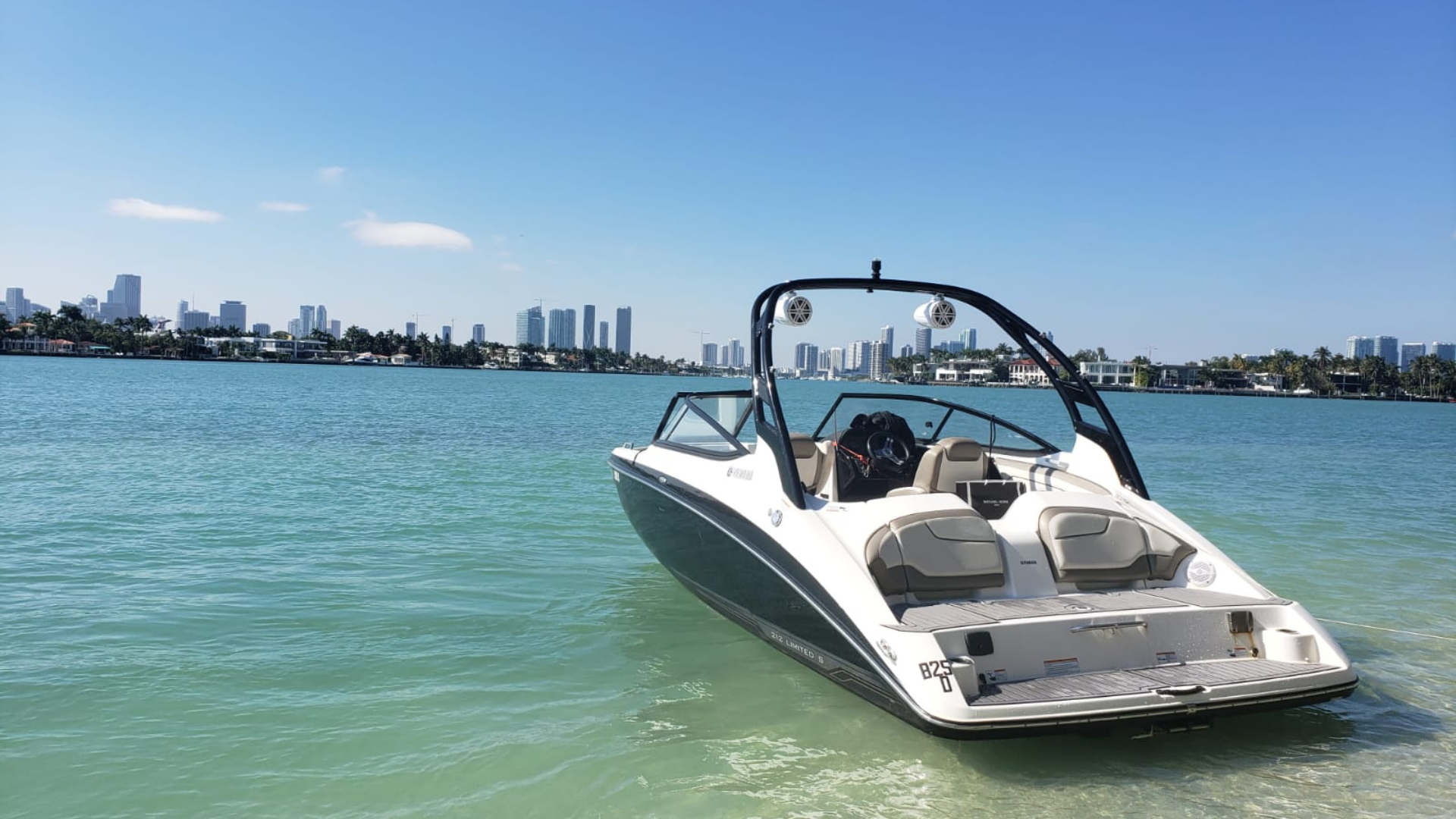 A boat is floating on top of a body of water