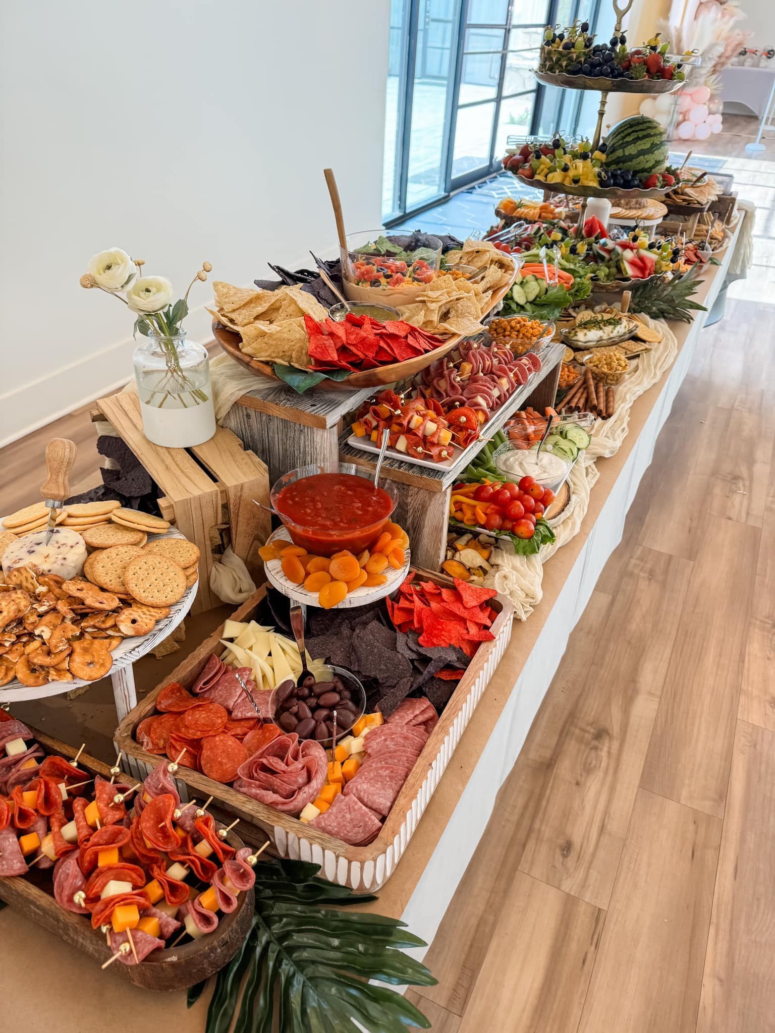 A long buffet table filled with lots of different types of food.
