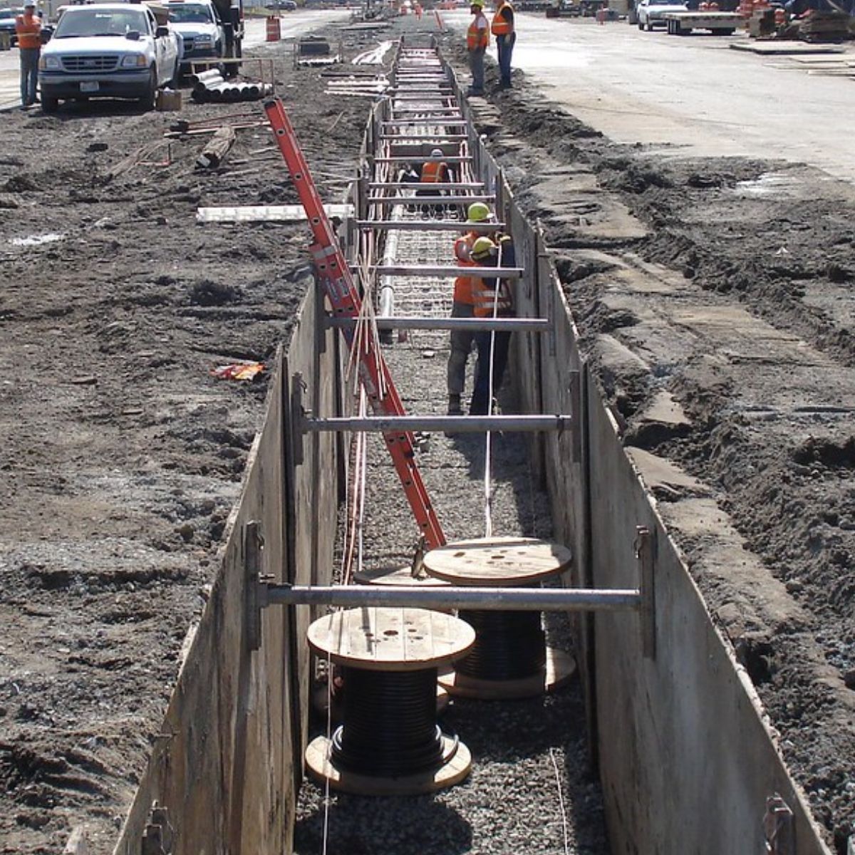 A construction site with a bunch of spools of wire