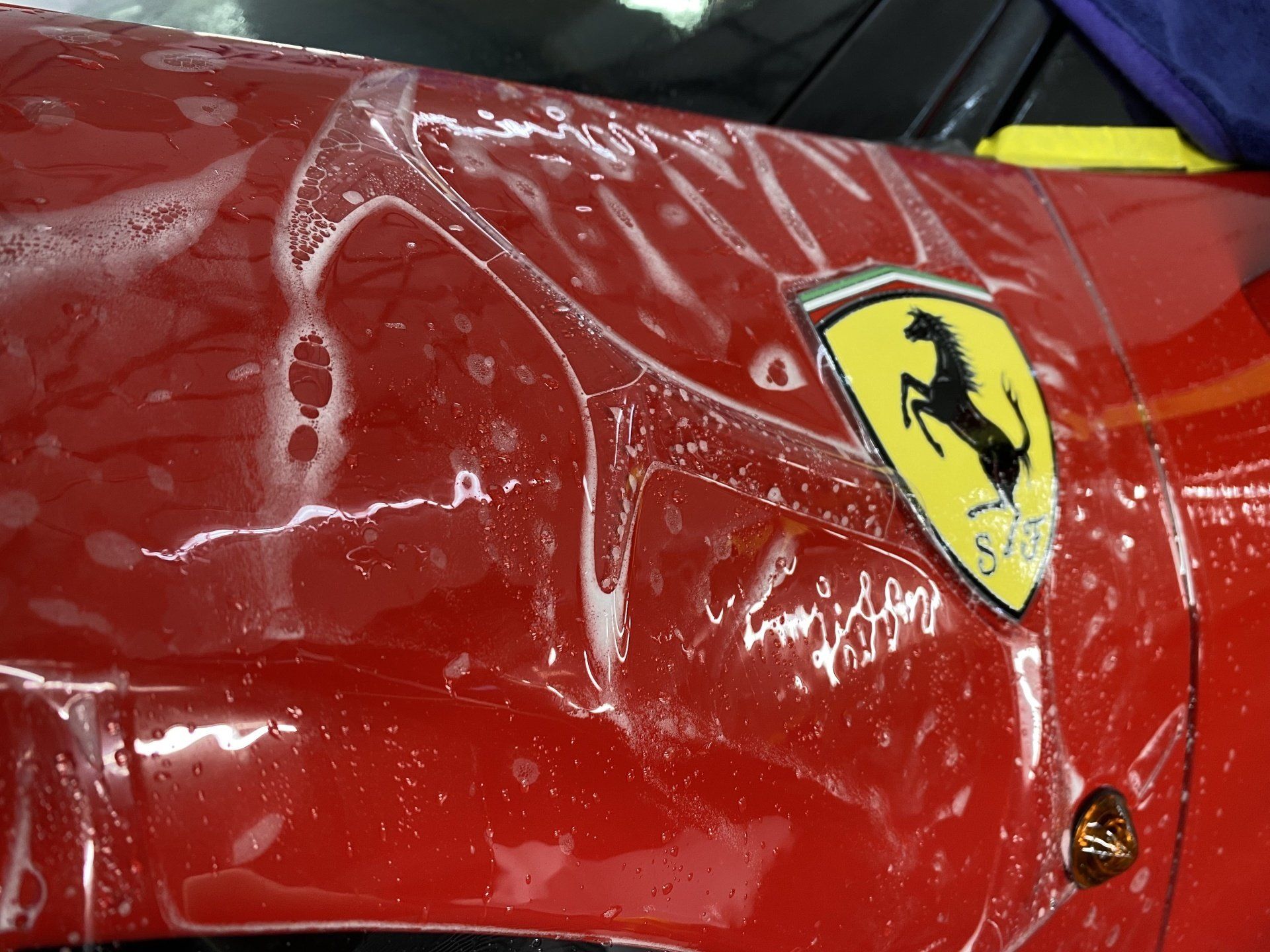 A red car with a ferrari logo on it