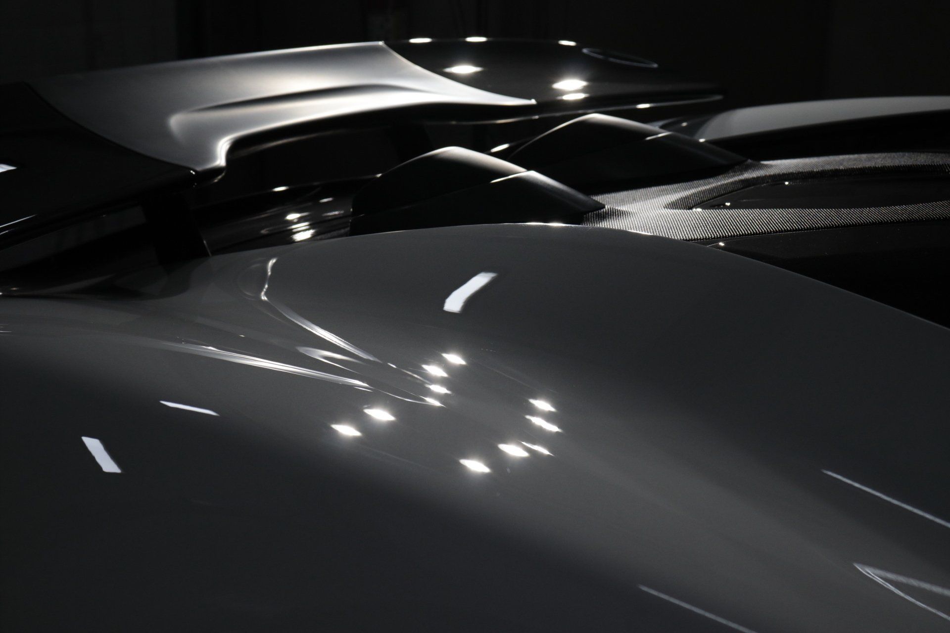 A black and white photo of a row of cars