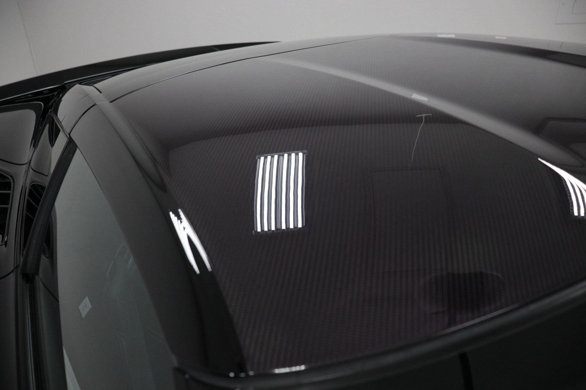 A close up of the roof of a black car