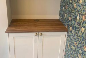 Fitted timber cupboards with white doors