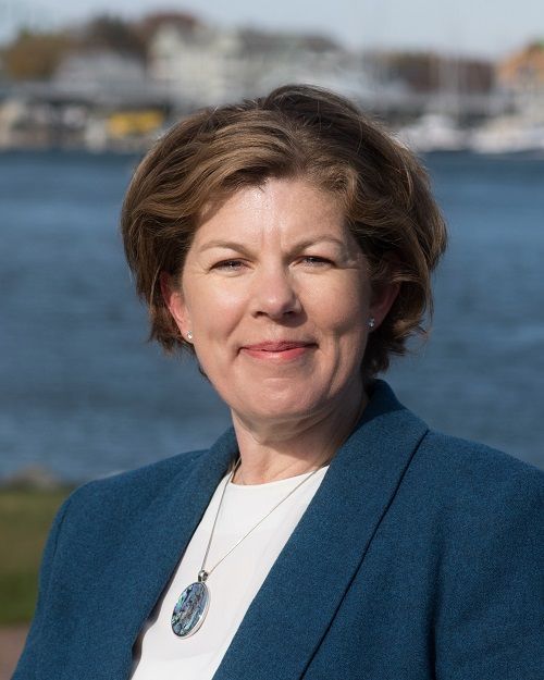 A Woman in a Blue Coat and White Shirt — Portsmouth, NH — Lager Susan R