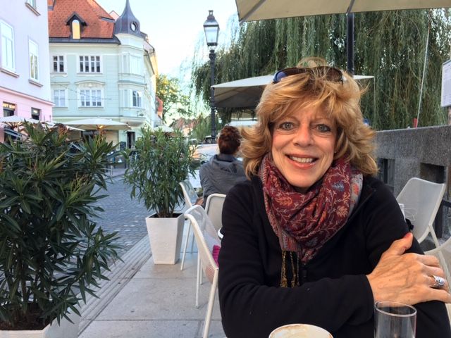 A Woman is Smiling While Sitting — Portsmouth, NH — Lager Susan R