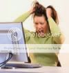 A Woman is Sitting in Front of a Computer Holding Her Hair — Portsmouth, NH — Lager Susan R