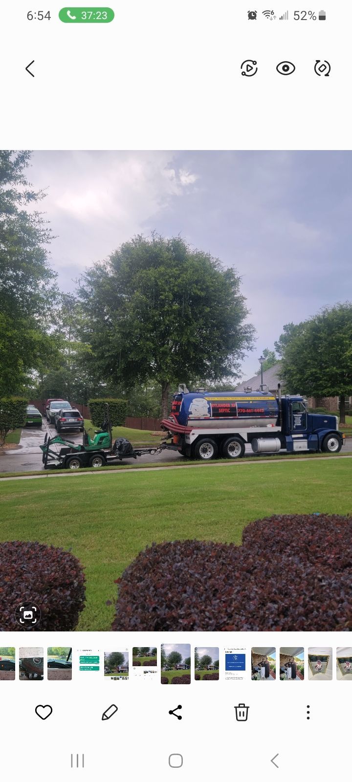 Blue Septic Truck & Green Trailer On Lawn