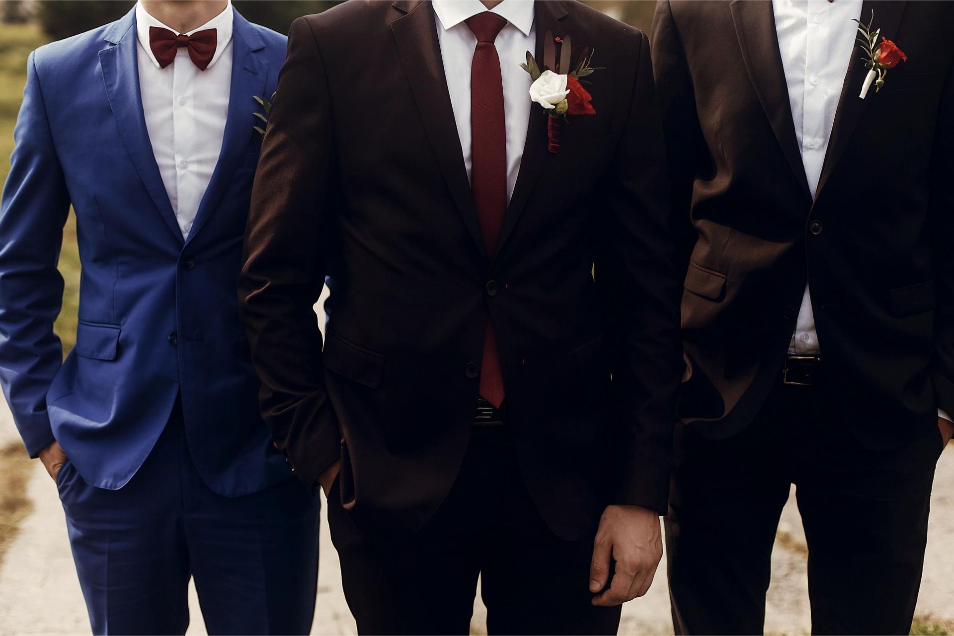 stylish groom groomsmen suits boutonniere posing