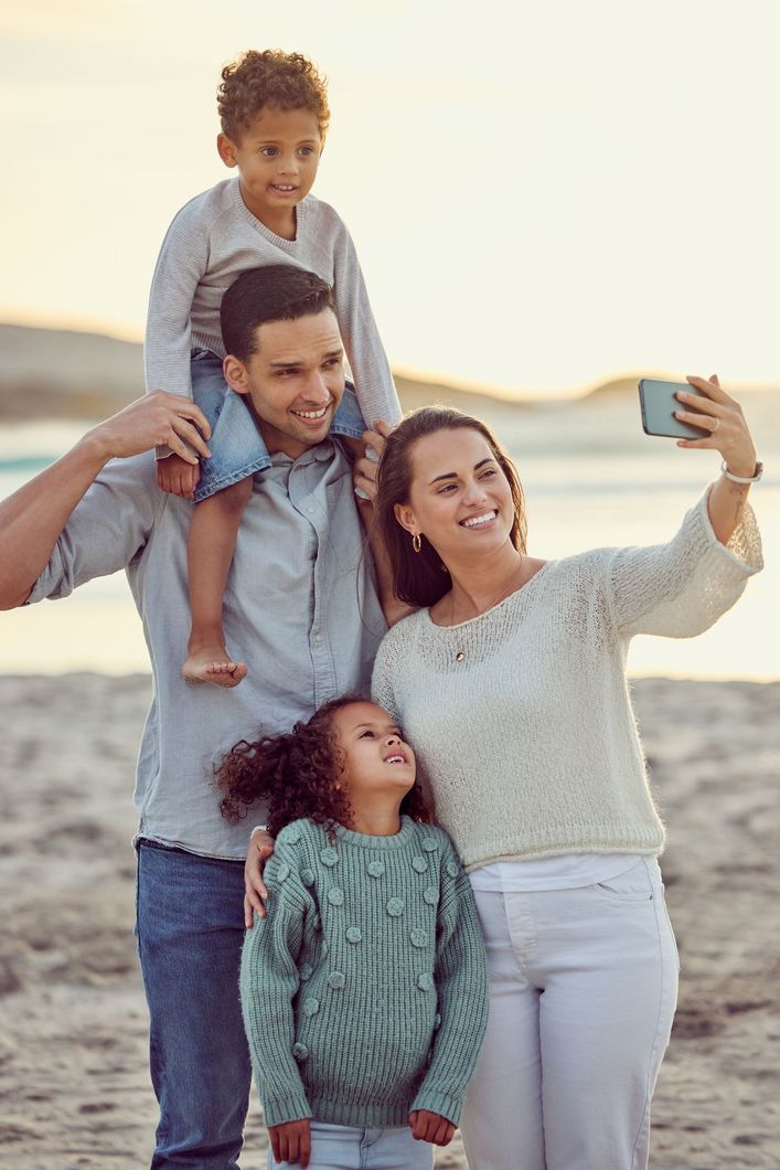 A family smiles after attending family counselling