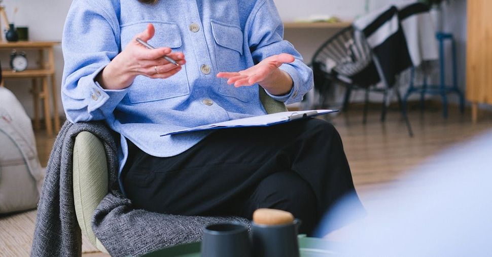 Counsellor gestures in a depression counselling session