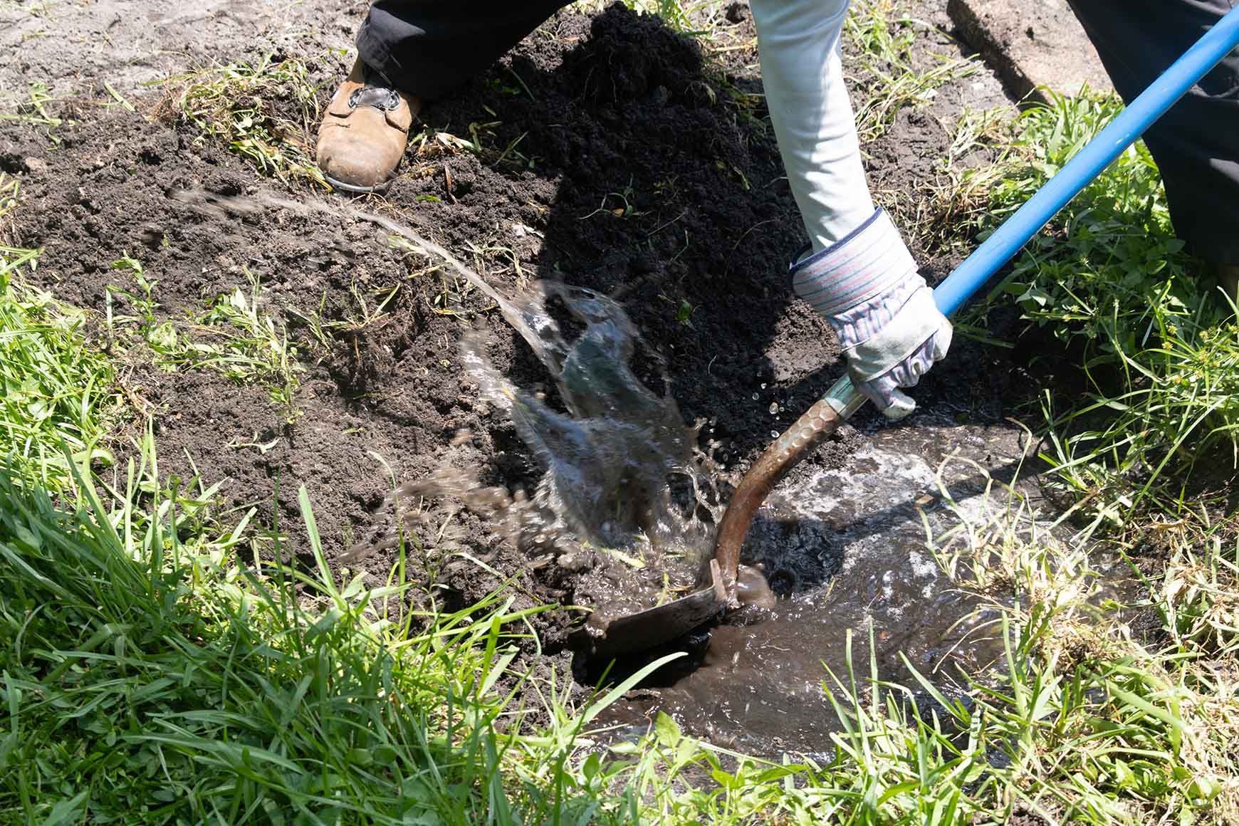 Man working on septic tank, showcasing professional skills for septic system repair services. Man working on septic tank, showcasing professional skills for septic system repair services.
