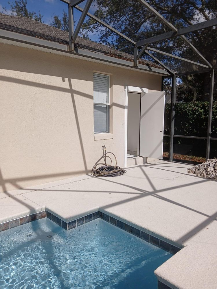 A house with a swimming pool in front of it